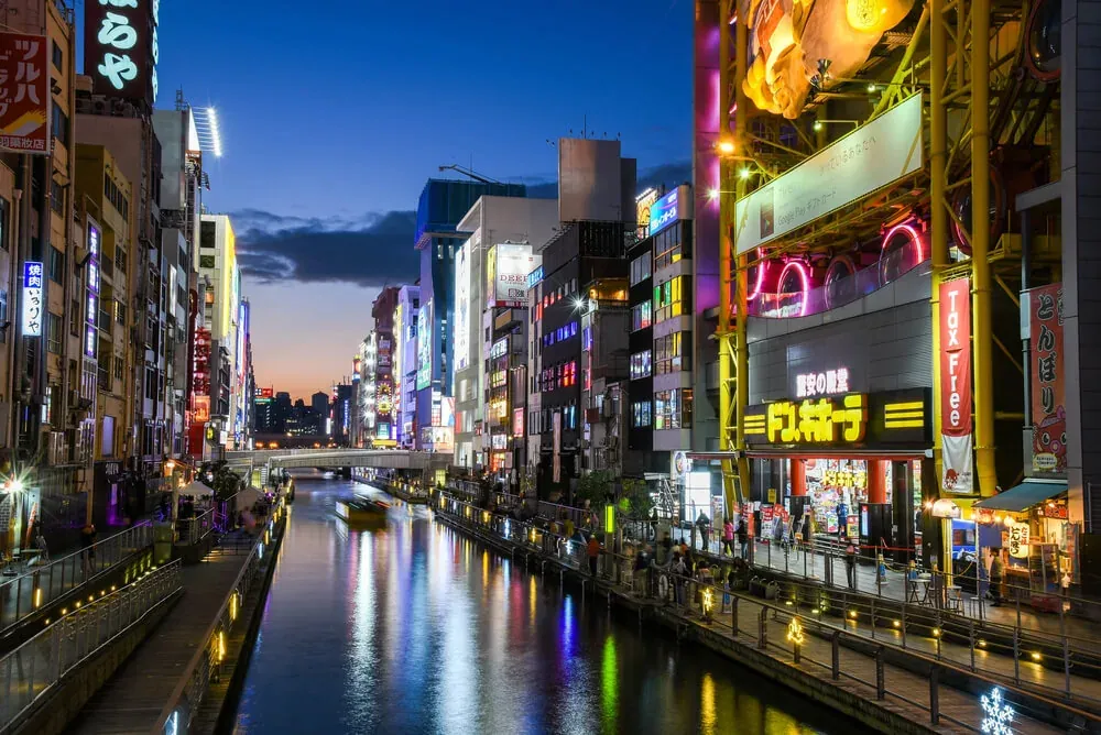 Dotonbori canal in Osaka with its neon signs in the evening