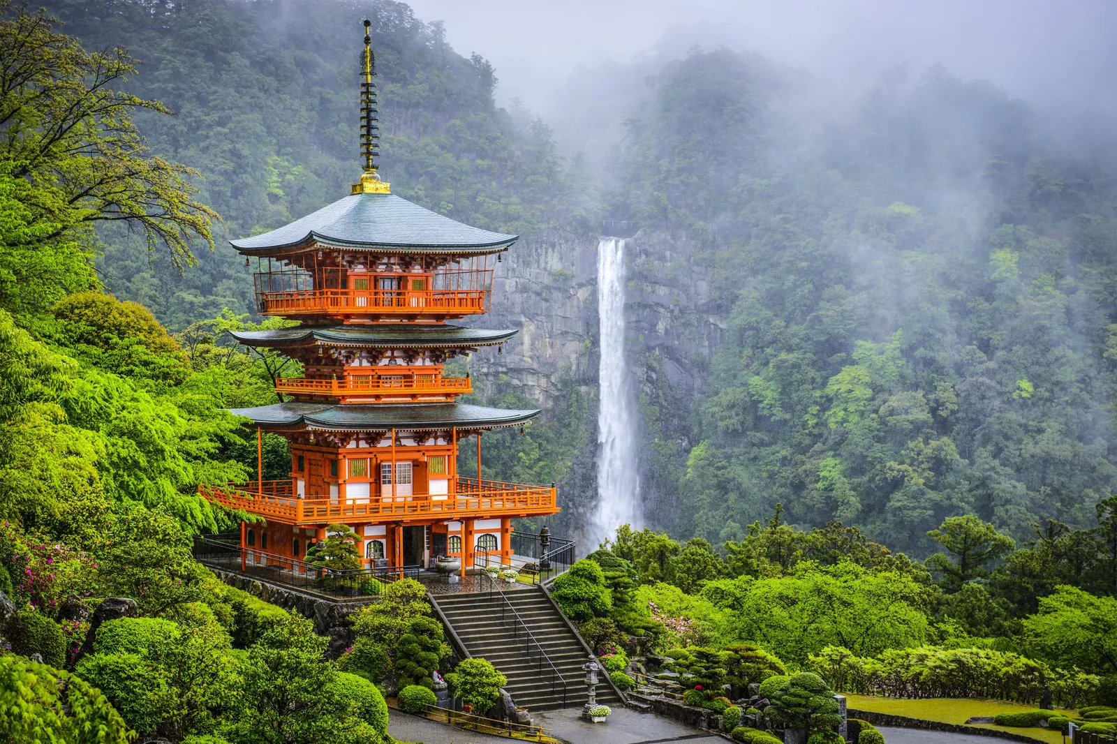 Seiganto-ji pagoda and Nachi Falls in misty green forest, Wakayama