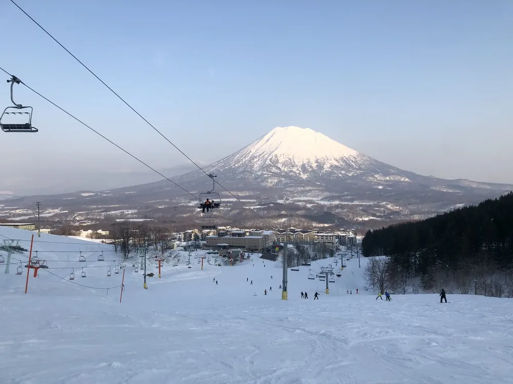 Ski slope at Niseko with snow-covered Mount Yotei behind, Hokkaido, Japan