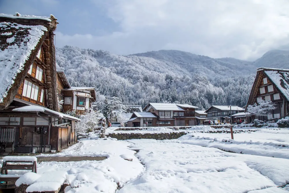 Thatched gassho-zukuri farmhouses in Shirakawa-go under winter snow